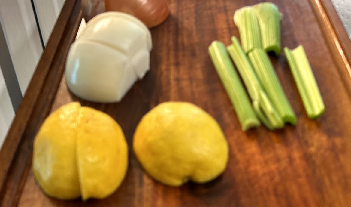 Roasted chicken stuffed with onion celery and lemon