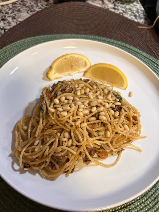 Sunny sardine angel hair pasta with basil, tomatoes, and pine nuts
