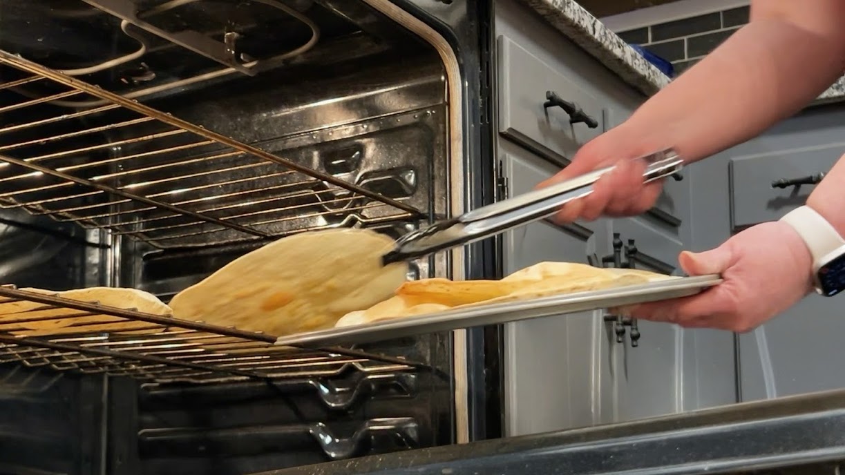 Crisped tortillas removed from oven