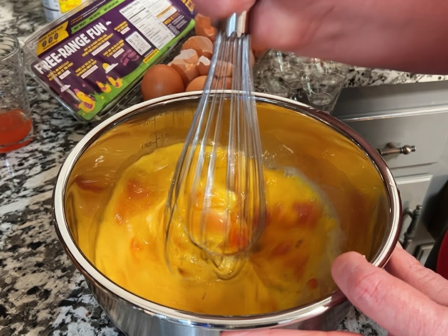 Eggs whisked with seasoning and Rotel
